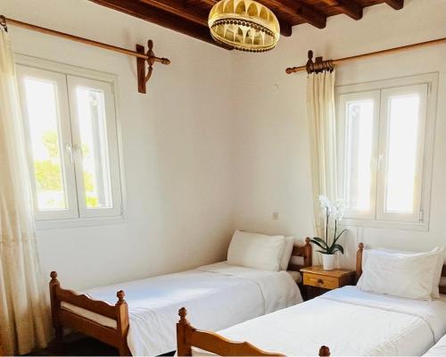 Llit o llits en una habitació de Villa Vasilis