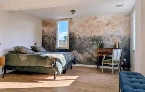 a bedroom with a bed and a desk at Domaine de Grave in Mirepoix