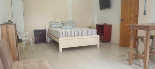 a bedroom with a bed with pillows on it at La tribu in Simiátug