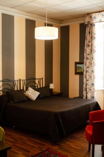 a bedroom with a large bed in a room at Soggiorno Michelangelo in Florence