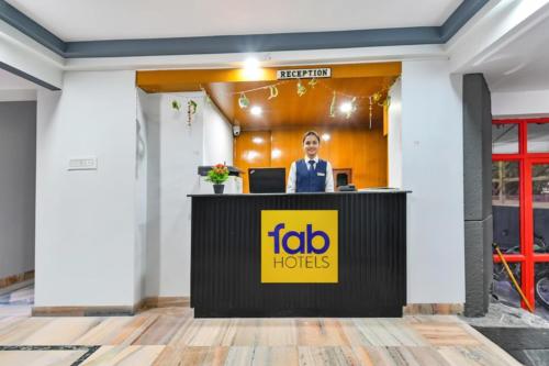 a ceo at the reception desk of a hotel at FabHotel Classic Holidays in Jaipur