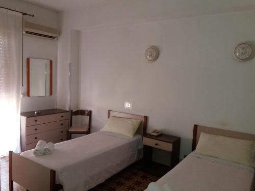 Postel nebo postele na pokoji v ubytování Albergo Europa