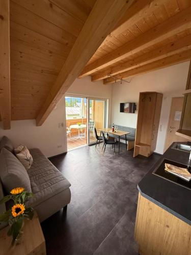 a living room with a couch and a table at Haus Lagger in Seefeld in Tirol