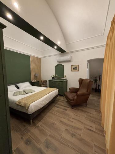 a bedroom with a bed and a chair at SVR Green in Bronte