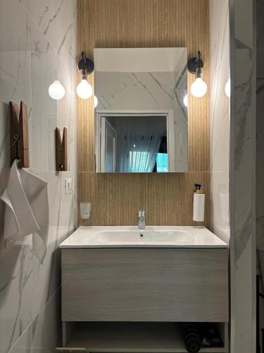 a bathroom with a sink and a mirror at SVR Green in Bronte