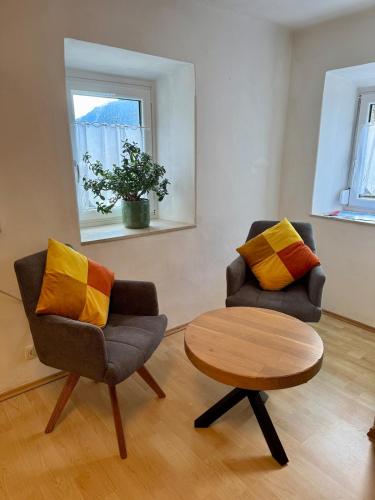 two chairs and a table in a living room at Haus Anna in Köttwein