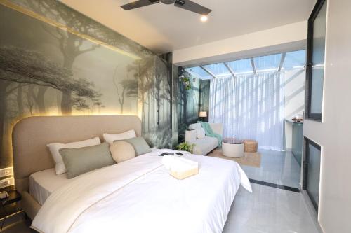 a bedroom with a bed with a large window at Chérie Bliss Loft in Jaipur