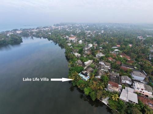 an island in the middle of a large body of water at Lake Life Villa in Ambalangoda
