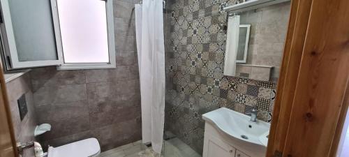 a bathroom with a sink and a toilet at Excellent Appartement S plus 3 in Kelibia