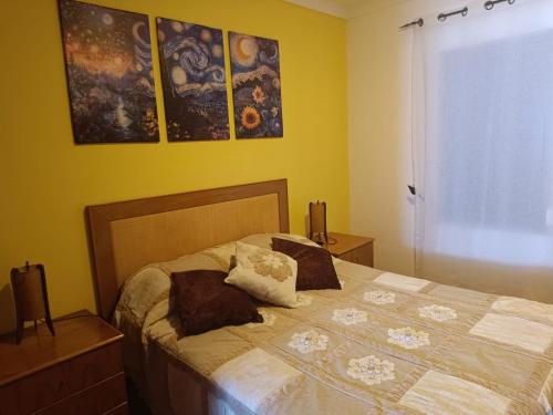 a bedroom with a bed with two pillows on it at MiRaRio in Vila Nova de Milfontes