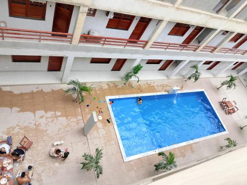 an overhead view of a large swimming pool in a building at Residencial Ibiapaba in Camocim