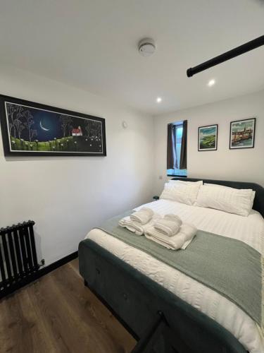 a bedroom with a bed with two towels on it at L'Appartamentino in Cork