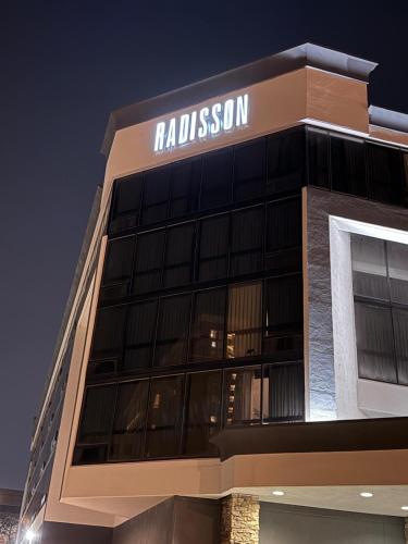 a building with a sign on the side of it at Radisson Hotel St Louis Downtown Convention Center in Saint Louis