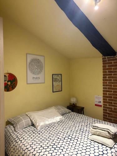 a bedroom with a bed in a room at Cascina Garaita in Fossano