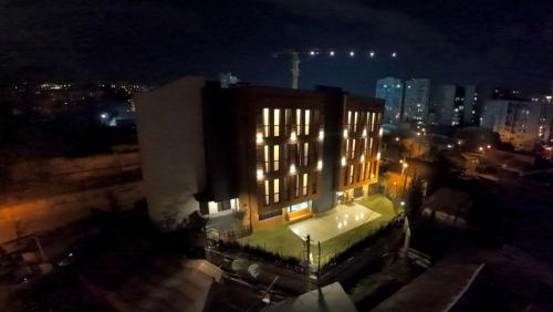 a building with lights on top of it at night at Hotel Tiflida in Tbilisi City