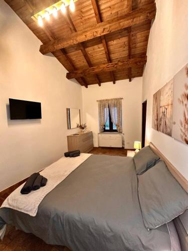 a large bedroom with a large bed in a room at Etruscan Brothers House in Cerveteri