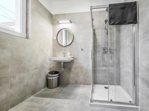 a bathroom with a shower and a sink at PP Home in Törökbálint