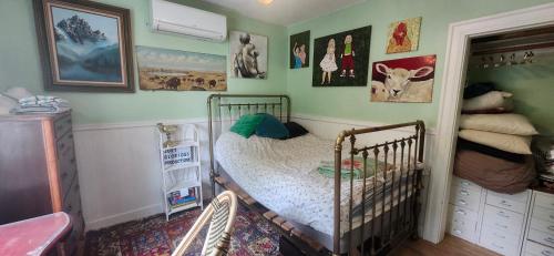 a childs bedroom with a crib in a room at Trout House by Trout Lake in Vancouver