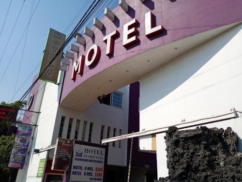 a hotel sign on the side of a building at Hotel Florencia in Mexico City