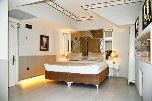a bedroom with a large bed in a room at Leyenda Boutıque Hotel in Istanbul