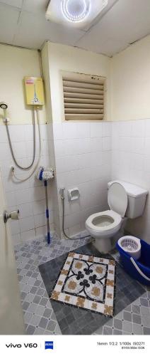 a bathroom with a toilet and a shower at Mansion phram6 B in Bangkok