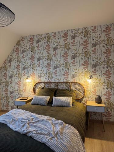 a bedroom with a large bed with two night stands at Appartement à Ohain in Ohain