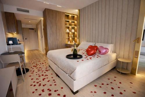 a hotel room with a bed with red hearts on it at Apartament 330 Przy Plaży, parking gratis! in Międzyzdroje