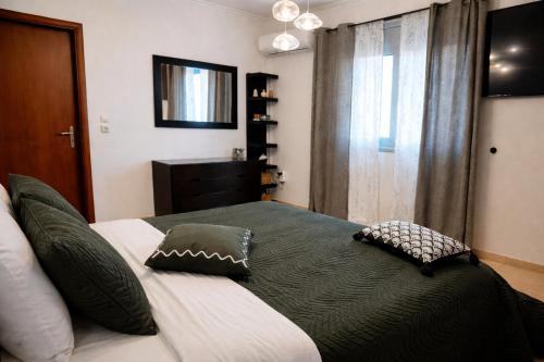 a bedroom with a large bed with pillows on it at Casa Verde Pastida in Pastida