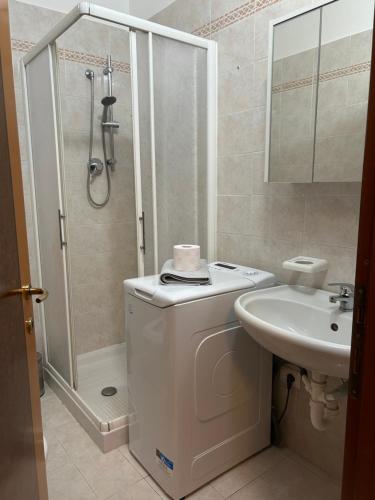 a bathroom with a shower and a toilet and a sink at Casa Ponte in Ponte San Giovanni