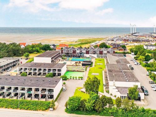 an aerial view of a resort with the ocean at 6 person holiday home Glesborg in Glesborg