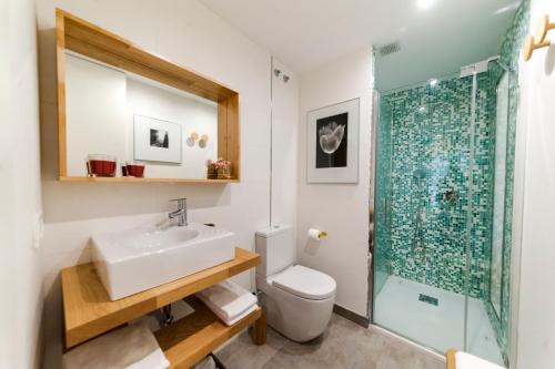 a bathroom with a sink and a shower at El Mirador Del Alcazar in Segovia