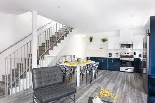 a kitchen and dining room with a table and chairs at Central LA Escape Near Universal & Beaches in Los Angeles