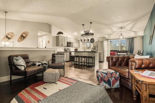 a living room with a couch and a table at The Loveland Haus in Loveland
