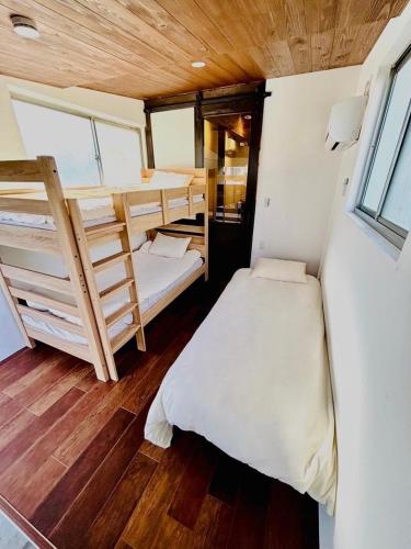 a small room with two bunk beds in it at Kamakura S house in Yokohama