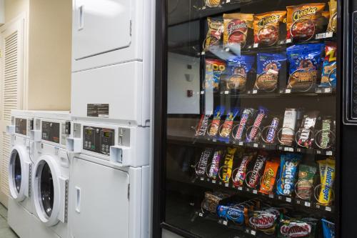 a refrigerator filled with lots of chips and snacks at Ramada by Wyndham Boston in Boston