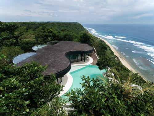an aerial view of a house next to the ocean at Nya Uluwatu in Uluwatu