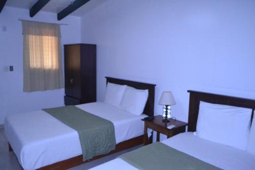 Llit o llits en una habitació de Security Services