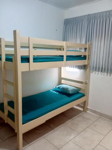 a bedroom with two bunk beds in a room at Dhika Adventure DPS in Denpasar