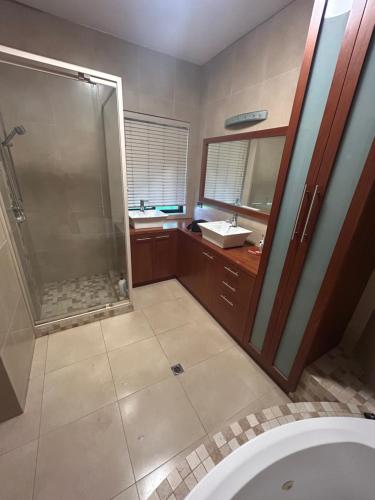 a bathroom with a shower and a sink at Comfort Home For You 203 in Perth