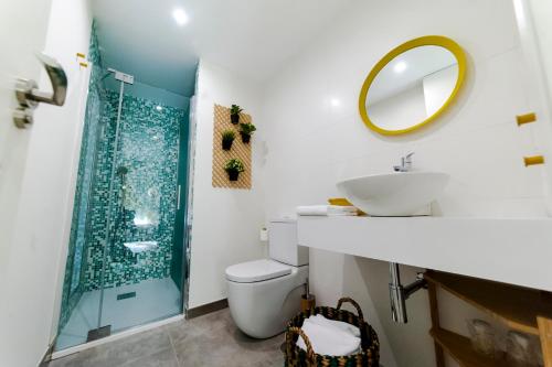 a bathroom with a shower and a toilet and a sink at El Mirador Del Alcazar in Segovia