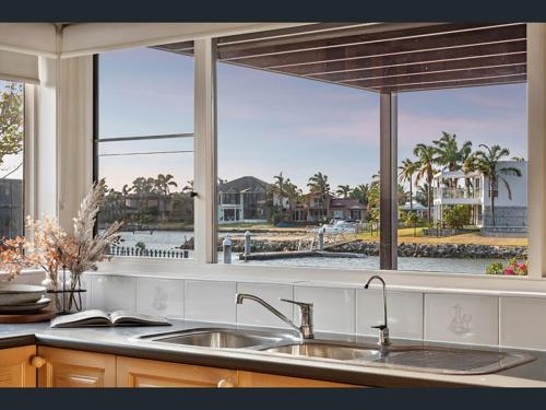 a kitchen with a sink and a large window at The Waterville in Patterson Lakes