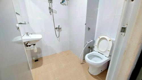 a bathroom with a toilet and a sink at Nagoya Mansion B1222 in Nagoya