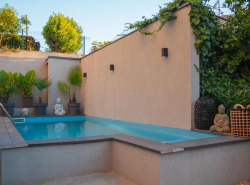 a swimming pool in the backyard of a house at Pula Garden Apartments with Shared Pool in Pula