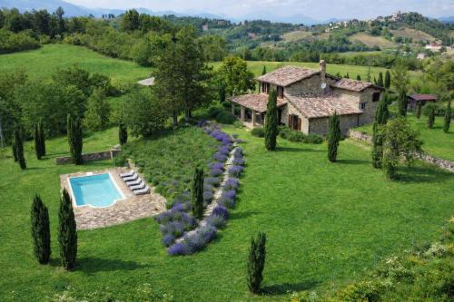 an aerial view of a house with a swimming pool at VILLA ADELE - Ville Carborello in Crispiero