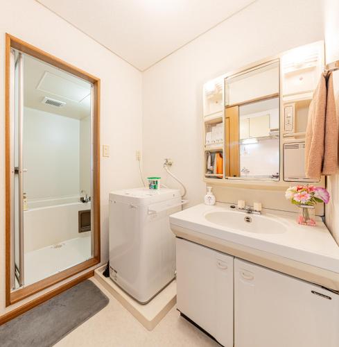 a bathroom with a toilet and a sink and a shower at Happy House NIshi-Koiwa Keisei Koiwa Station 5min in Tokyo