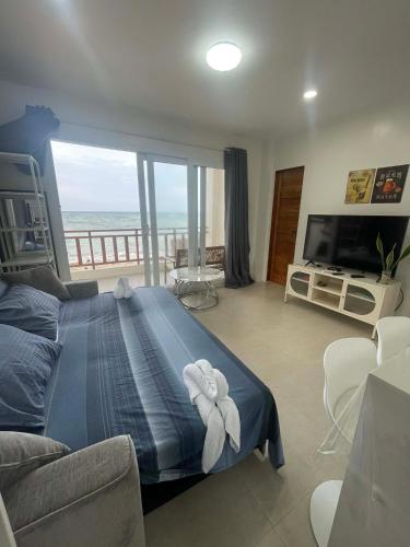 a bedroom with a bed with a view of the ocean at Tyne Haven in San Juan