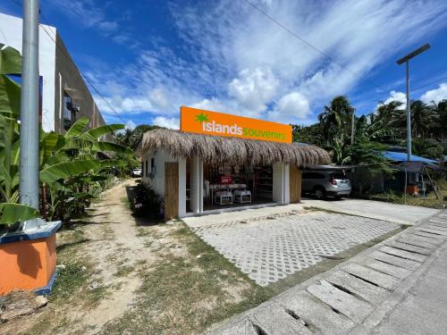a store with a sign on the front of it at Monera's Native Cabin in San Juan