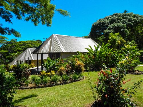 a house in the middle of a garden at Taveuni Dive Resort in Waiyevo
