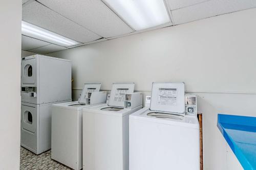 a row of washers and dryers in a room at Motel 6-Dumfries, VA in Dumfries