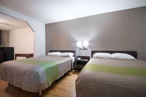 Ένα ή περισσότερα κρεβάτια σε δωμάτιο στο Motel 6-New Iberia, LA